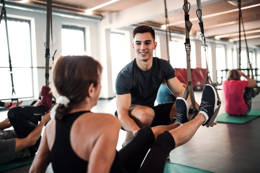 physical therapist helping his patient stretch before exercise