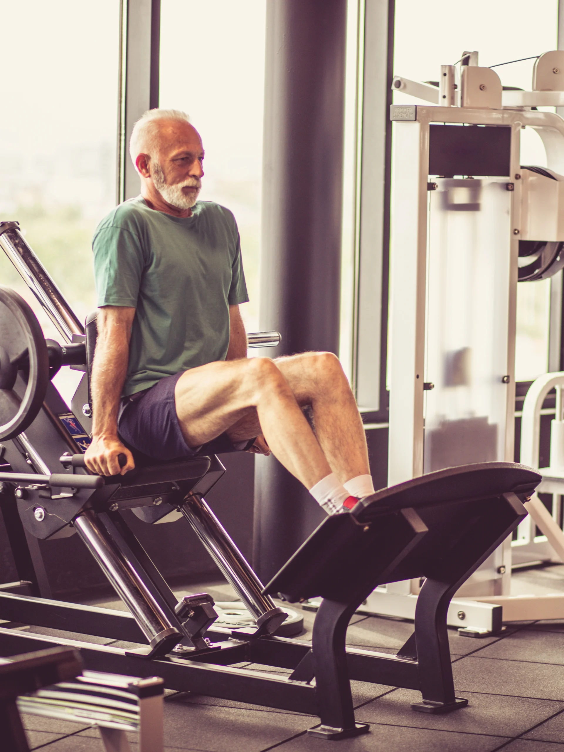 mature adult using exercise equipment to help with unwanted knee pain